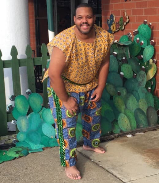 Joel Lomnick participating in African drum and dance cultural arts.